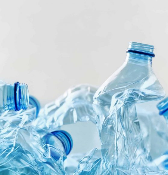 Crushed plastic bottles heap ready for recycling